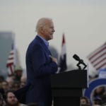 Biden sneaks up on Sanders in Washington