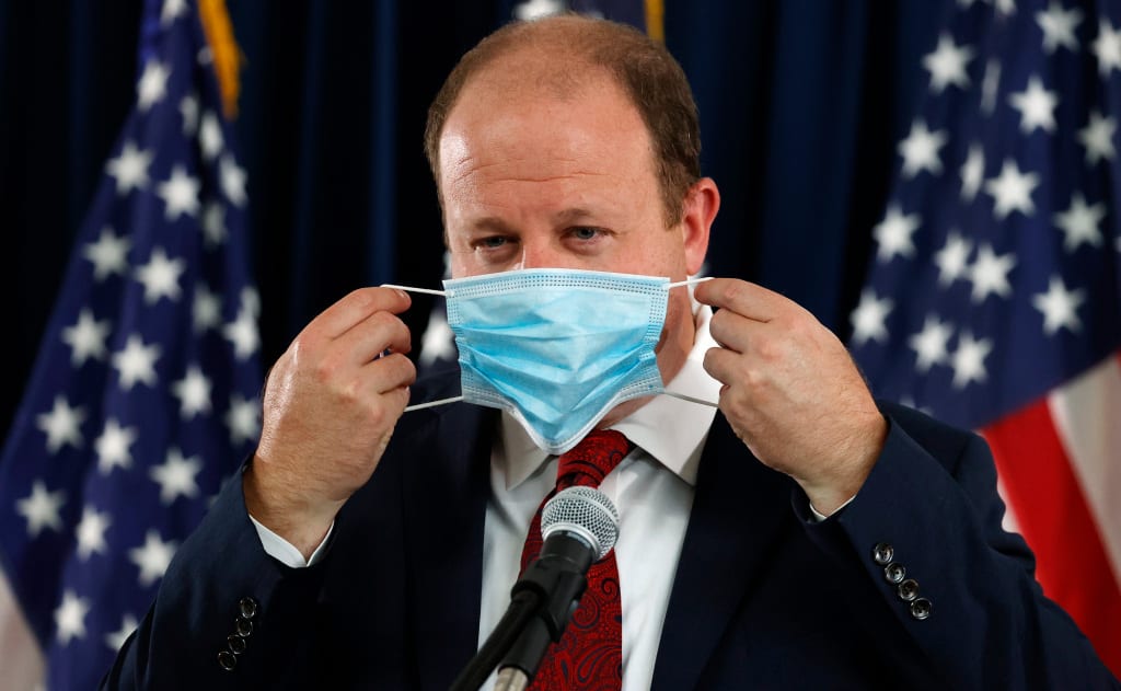 Gov. Jared Polis plans to extend Colorado’s mask mandate