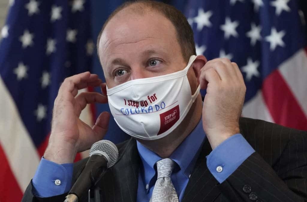 Colorado limits more gatherings as COVID cases spike