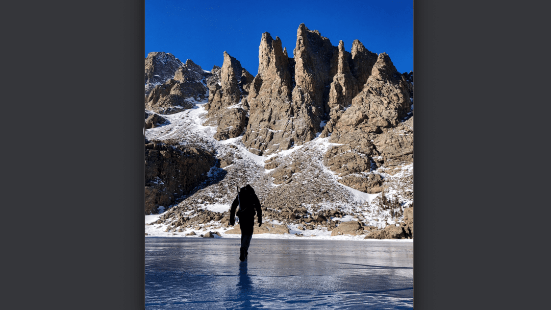 Frozen alpine lakes and icy waterfalls encountered on winter hike to Sky Pond in Colorado | OutThere Colorado