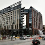 Dick Monfort says the Colorado Rockies and McGregor Square are separate entities, but the two share a common baseball seam