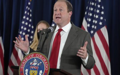 Colorado governor supports redefining what it means to be fully vaccinated